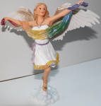 Gai is a great angel. She stands on one of my merman curios. She gets lit up at night and shines above the cabinet like she watches over the mermen