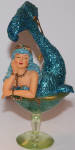 I honestly thought December Diamonds didn't do the mermaid in the champagne glass until 2006. This one pre-dates her by three years. She is stunning with her blue sparkle. I know I have a classic in my collection with Blue Hawaiian mermaid. A stunner.She was made before Mr. Manhattan merman which is the second merman made. Early onefor sure.
