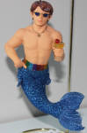 One of the very first mermen made and one of the first I owned. Manhattan is the prototype of the contemporary mermen to come. Nemo and Poseidon weren't contemporary in appearence. I like the pride colors on his waist belt.