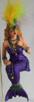 There's no underestimating the beauty of this particular mermaid. When looked at up close, the colorful feathers and purple glitter show off the vibrance of the ornament. One of December Diamonds' best! She is Jambalaya's mermaid counterpart.