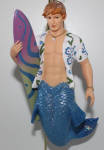Surfer dude was ok to me. I am not a surfer, and California is the surfing capital of the US, not NYC. I took him just to complete the collection of mermen for that year. Cool surfboard design. His mermaid counterpart is Surfer Girl.