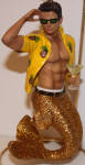 Aloha has those pineapples on his shirt!! I love this design! It's the best yet! He is gold tailed in a great pose like that commercial� who's behind those Foster Grant's? I can't wait to go to the tropics when I see this merman. His counterpart is Mai Tai II.
