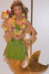 Mai Tai II is the counterpart to Aloha merman. There is another Mai Tai, but she looks like Bahama Mama in size and relates nothing to this one. This Mai Tai is nice of her detail. Grass skirt, Lei, Mai Tai drink, all detailed and wonderfully crafted. These mermaids get better with their detailed appearances every year.