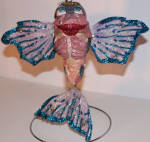 These early ornaments with the wired glitter tails are cool in their own right. Angelica looks great especially when you drag open the fins wide. She looks great! 